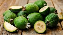 feijoa-cut-out-on-wooden-table.jpg