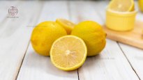 lisbon-lemon-on-wooden-table-background.jpg